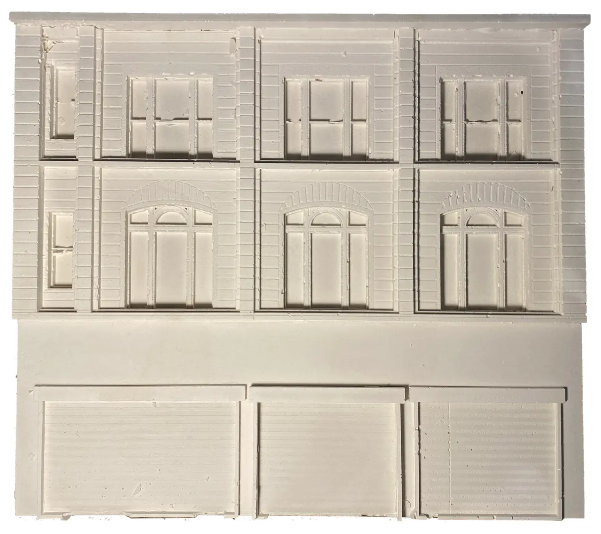 This building has been chosen due to the clear retrofit it has already undergone. The building has two halves, a modern function on street level with roller shutter doors. These doors seem very out of place as they are not shy in hiding their presence. Then the top half is traditional stone and mortar with some elements of detailing around the windows. I wonder what the addition would look like with the zero- carbon material repair pallet. - Ryan Cooksey Building 2 Model 2.png